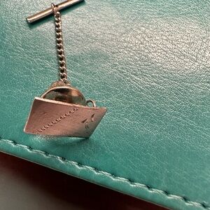 Vintage silver tone Envelope tie tack on chain.